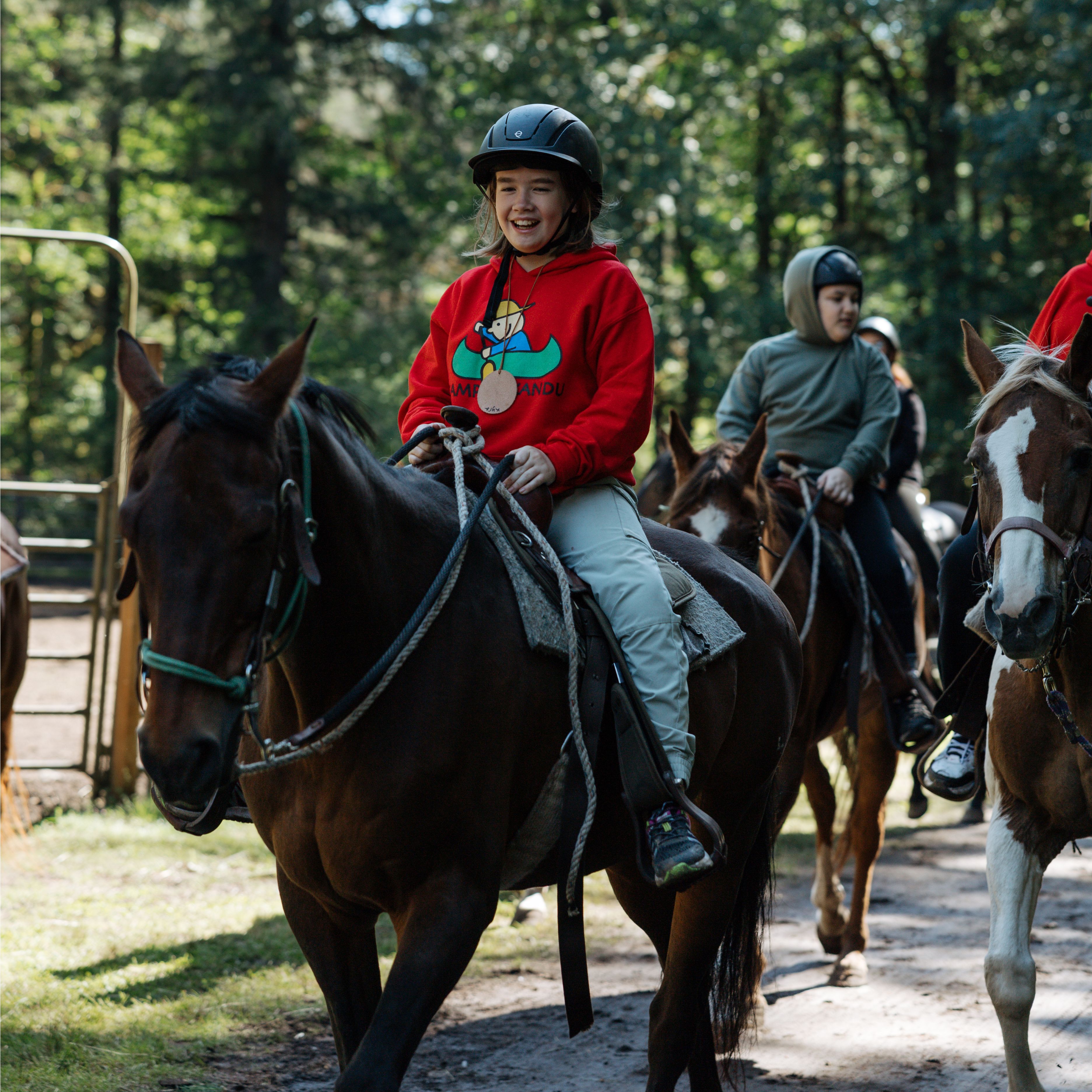 Camper riding horse